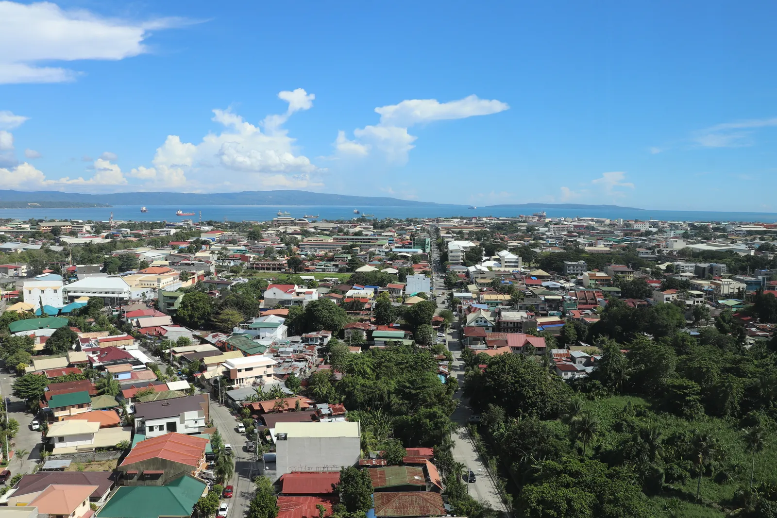 Davao City skyline viewed from Abreeza tower with Davao Gulf