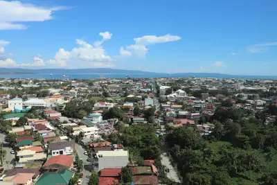 Davao City skyline viewed from Abreeza tower with Davao Gulf