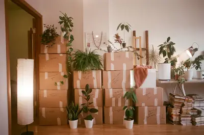 Stacked moving boxes in a room ready for relocation