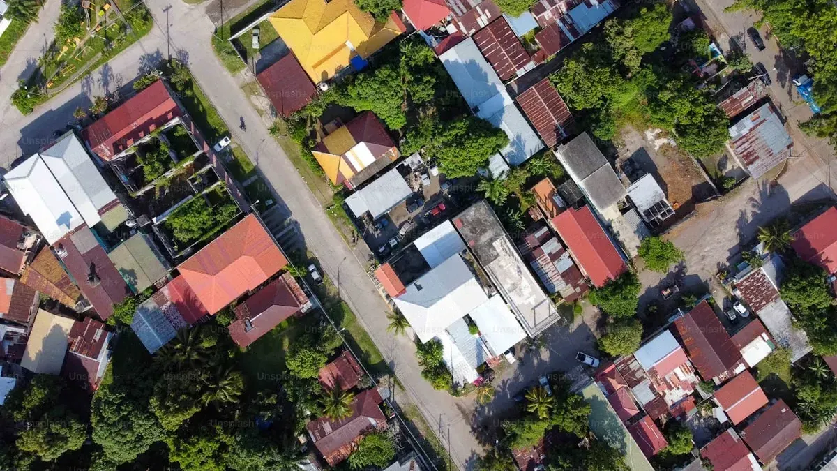 Aerial view of a Davao residential mix — single-detached houses next to small apartment blocks, the choice this article is about