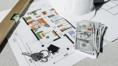 House keys on a floor plan with cash and a hard hat — symbolic of a Davao lease signing and the money on the line