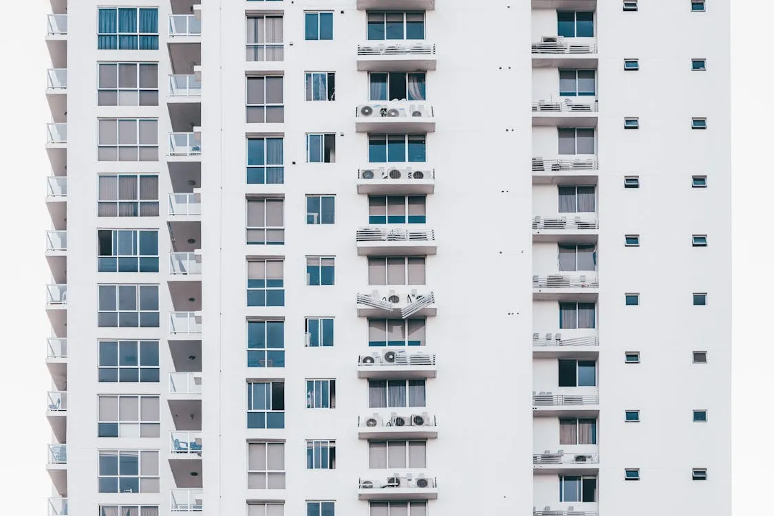 Multi-storey residential building with AC units typical of boarding house areas