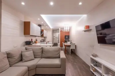 Furnished studio apartment with living area and kitchen